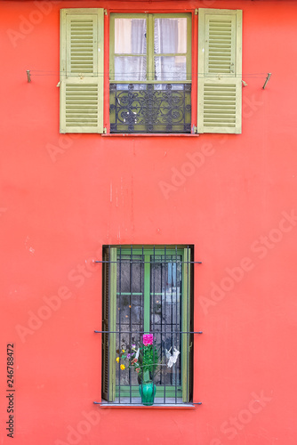 Nice, colorful facade, with typical windows and shutters
