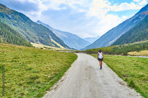 Hiking and biking on a trail in Krimml valley in Austria