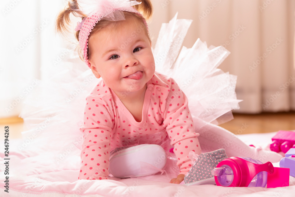 Baby girl crawling on the nursery floor Baby girl crawling on the nursery floor
