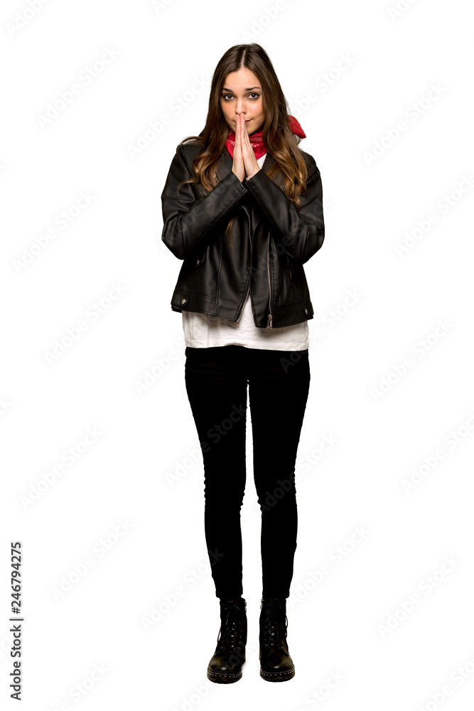 Full-length shot of Young woman with leather jacket keeps palm together. Person asks for something on isolated white background Full-length shot of Young woman with leather jacket keeps palm together. Person asks for something on isolated white background