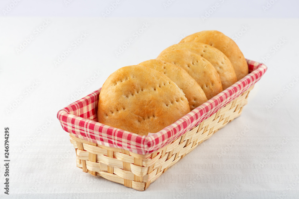 little unleavened bread in a wicker basket. Yakut cuisine little unleavened bread in a wicker basket. Yakut cuisine
