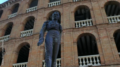 Statue of the bullfighter and banderillero Manolo Montoliu in the exterior of the Valencia bullring photo