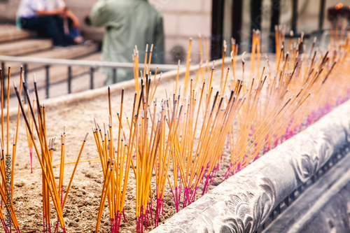 Joss sticks. Burning incense sticks. A close up of burning incense sticks