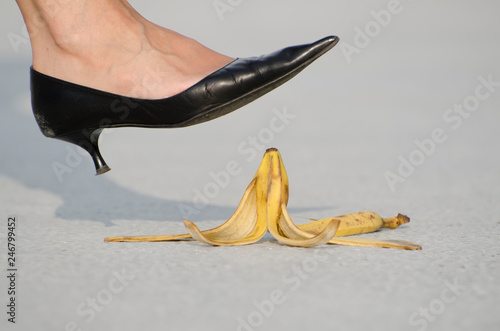 Woman with High Heels Shoes Walking on Banana Peel.
