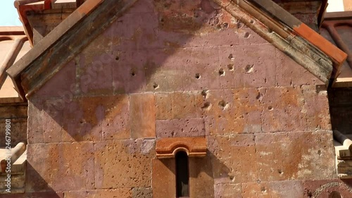 katoghike church with bullet holes in photo