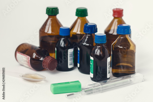 Medicine bottles on white background with copy space for text, retro concept closeup.