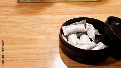 Swedish snus tobacco, snuff, placed under upper lip, similar to American dipping tobacco, illegal in all the European Union except Sweden, alternative to smoking or chewing nicotine photo