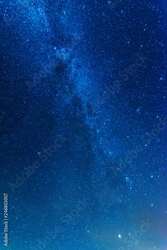 Bright night starry sky with millions of stars and galaxy Milky Way.