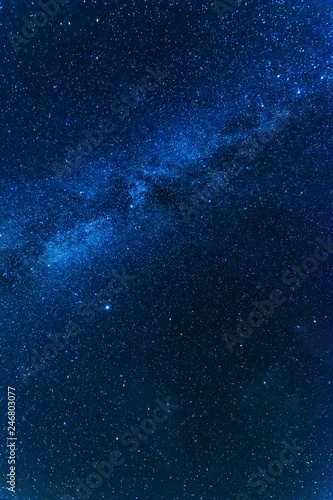 Bright night starry sky with millions of stars and galaxy Milky Way.