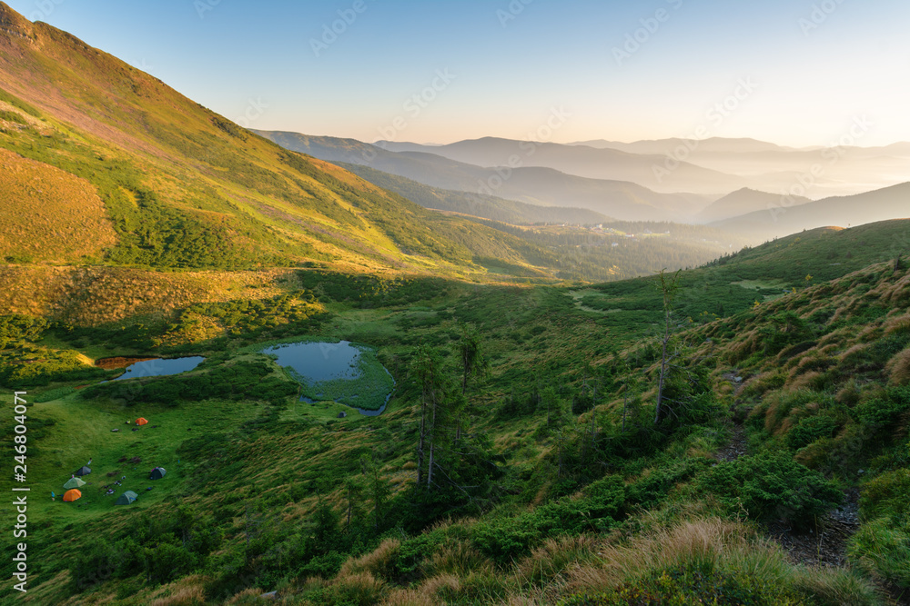 Obraz premium Tourist resort and skiing grounds Drahobrat with mountain slopes, lakes and lifts that are in the territory of the Carpathian Biosphere Reserve.
