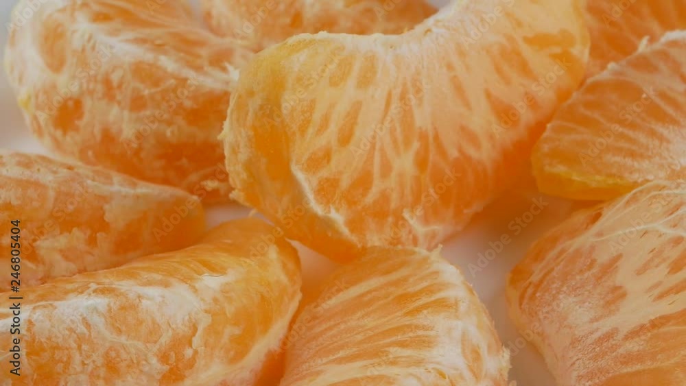 Tangerines or mandarin orange fruits and peeled segment. Tangerines or mandarin orange fruits and peeled segment.