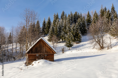 Landscape with Romanian traditional village in a winter day © czamfir
