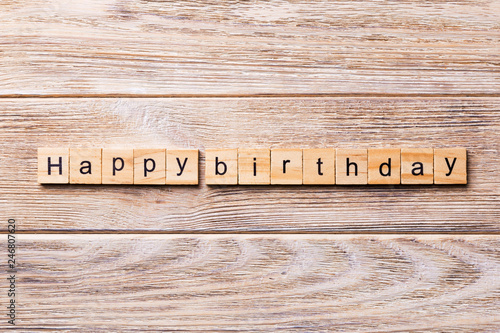 Happy Birthday word written on wood block. Happy Birthday text on wooden table for your desing, concept