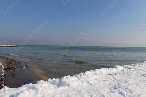 Snow on the sand of the Black Sea