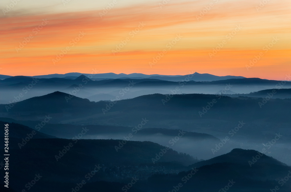 Obraz premium Dramatic sunrise over beautiful mountain peaks. Decinsky Sneznik, Czech republic
