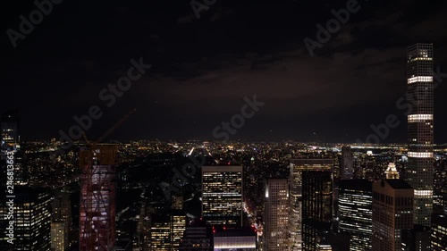 night timelapse as seen from Rockefeller center new york looking into central park during night with clouds moving photo