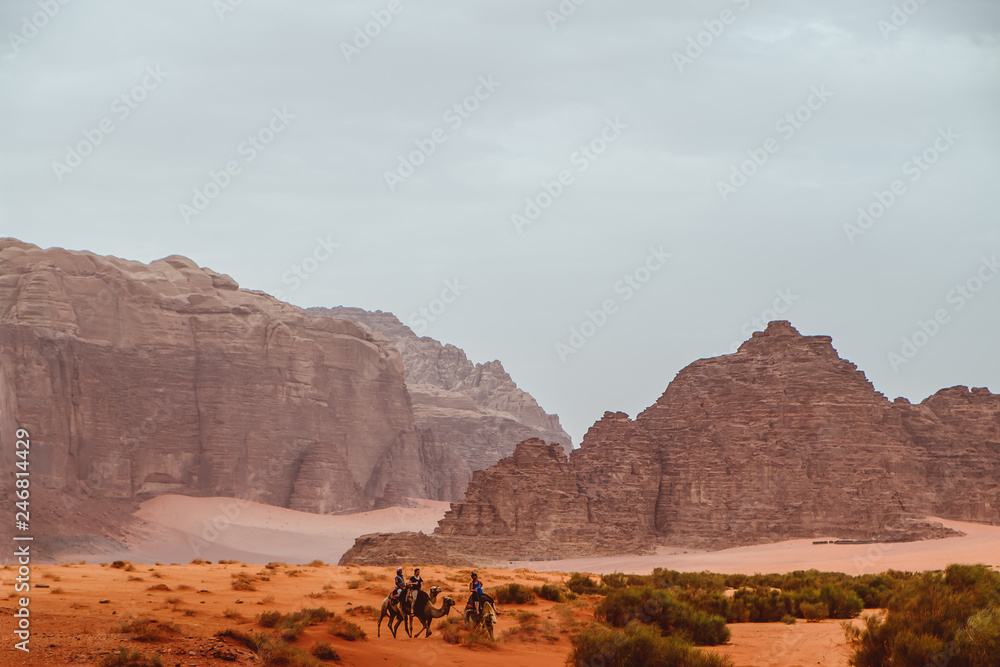 Red mountains of the canyon of Wadi Rum desert in Jordan. Wadi Rum also known as The Valley of the Moon is a valley cut into the sandstone and granite rock in southern Jordan to the east of Aqaba.