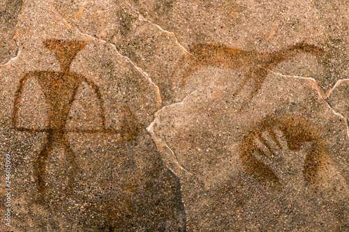the image of an ancient man on the wall of the cave. history of antiquities. era.