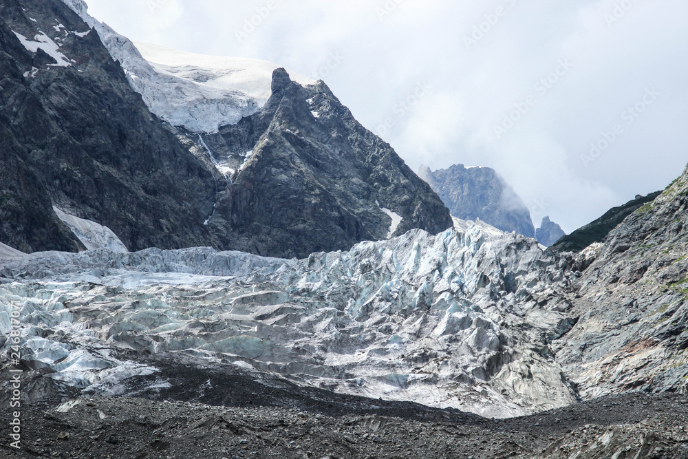 Cold harsh nature of Mount Ushba: rocks and glacier