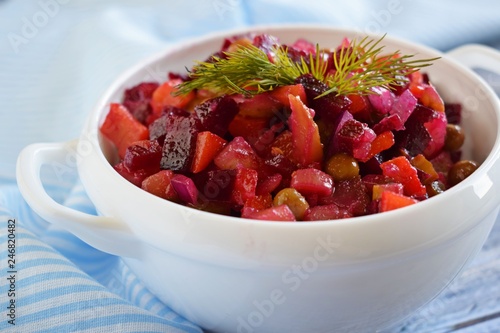 Vegetable salad with carrots and beets.Vinaigrette on a white plate.Vegetarian food.