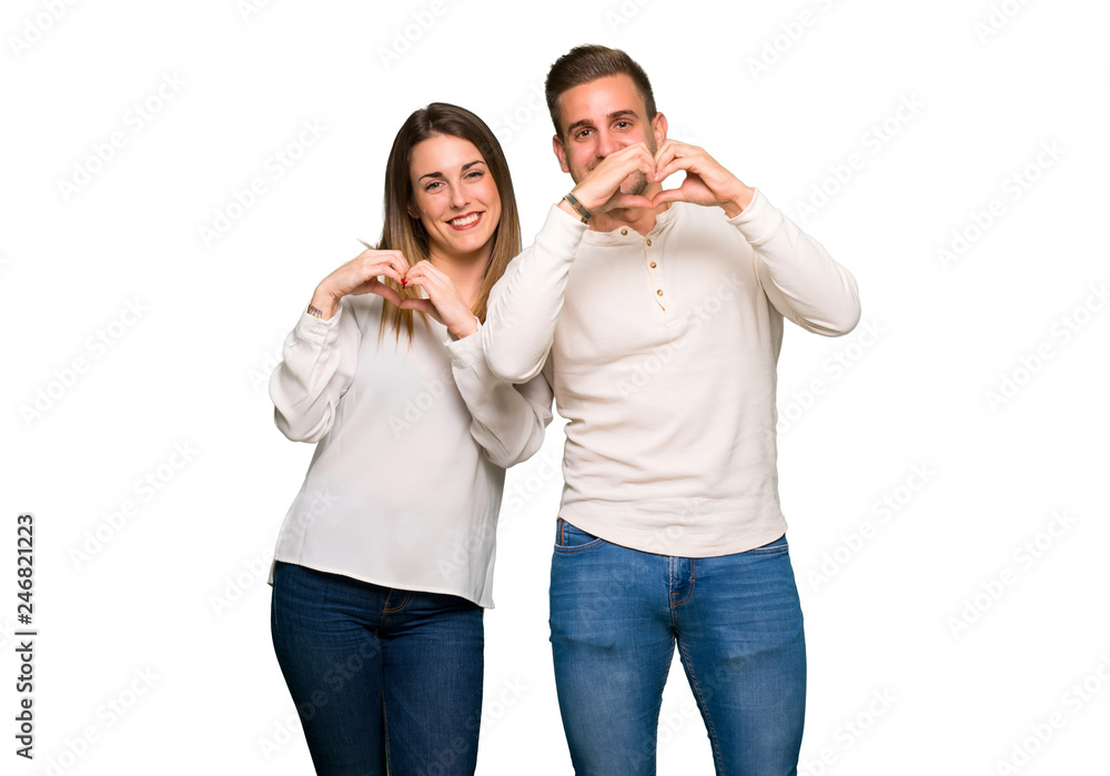 Couple in valentine day making heart symbol by hands Couple in valentine day making heart symbol by hands