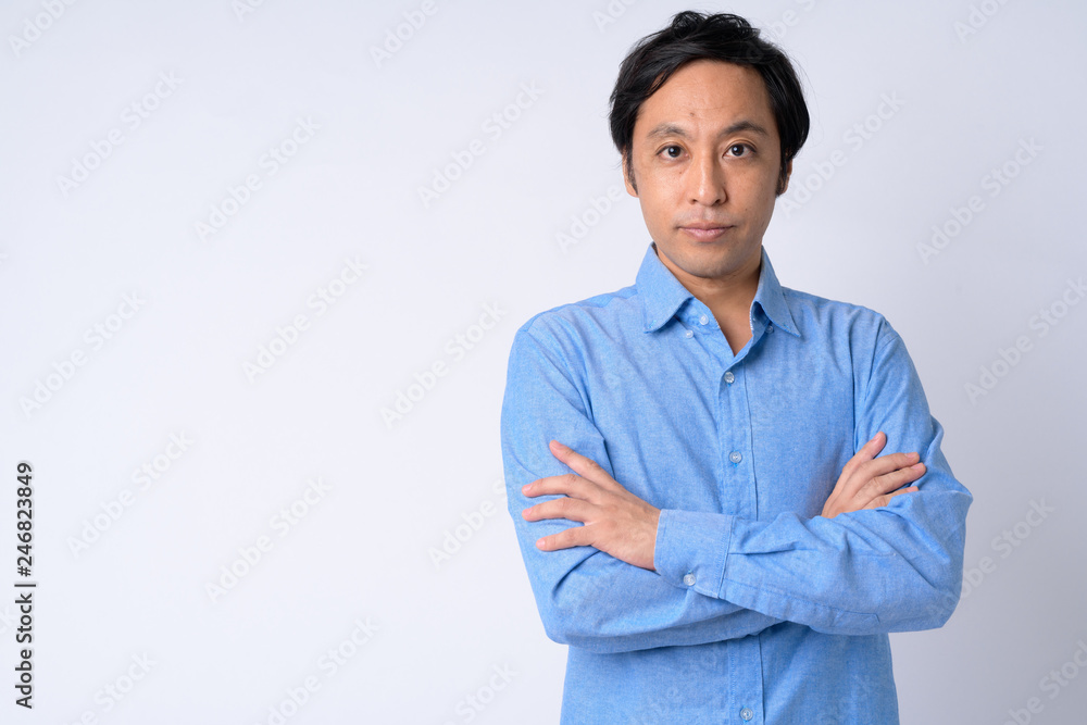 Portrait of Japanese businessman with arms crossed Portrait of Japanese businessman with arms crossed