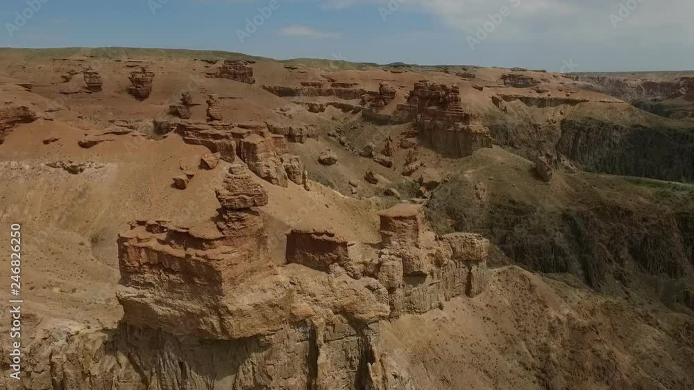 Panorama from the air of the rocks and Canyon Charyn. Kazakhstan. Video from top to bottom. Beautiful scenery and red amazing rocks. Panorama from the air of the rocks and Canyon Charyn. Kazakhstan. Video from top to bottom. Beautiful scenery and red amazing rocks.