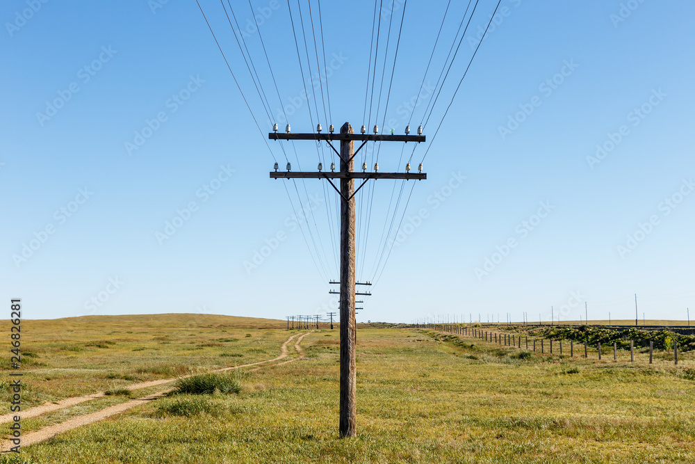 overhead line on wooden supports in the Mongolian steppe, Bayan Mongolia
