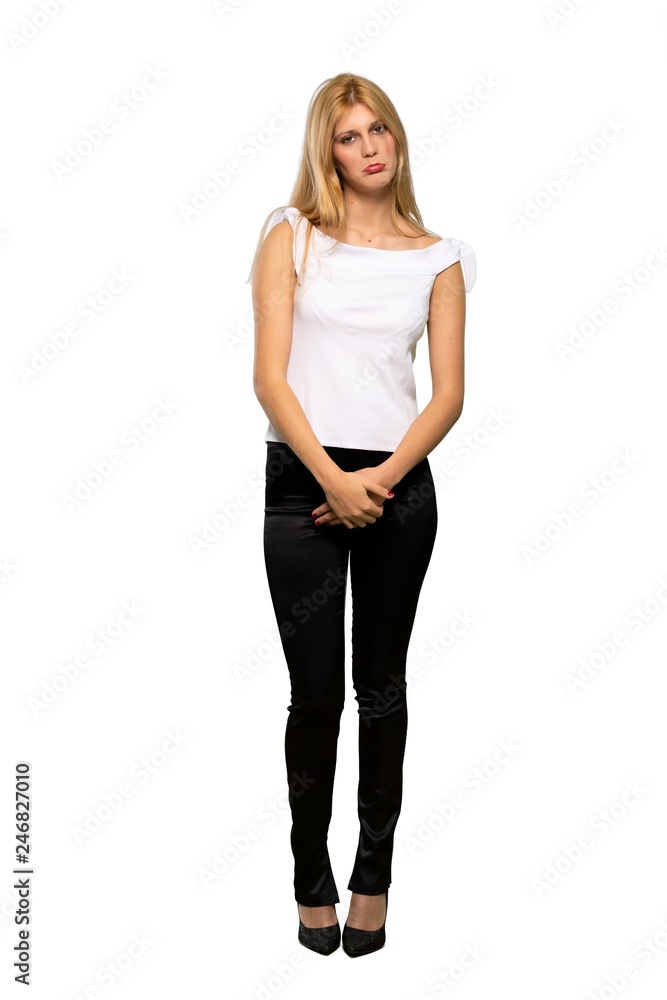 Young blonde woman with sad and depressed expression over isolated white background Young blonde woman with sad and depressed expression over isolated white background