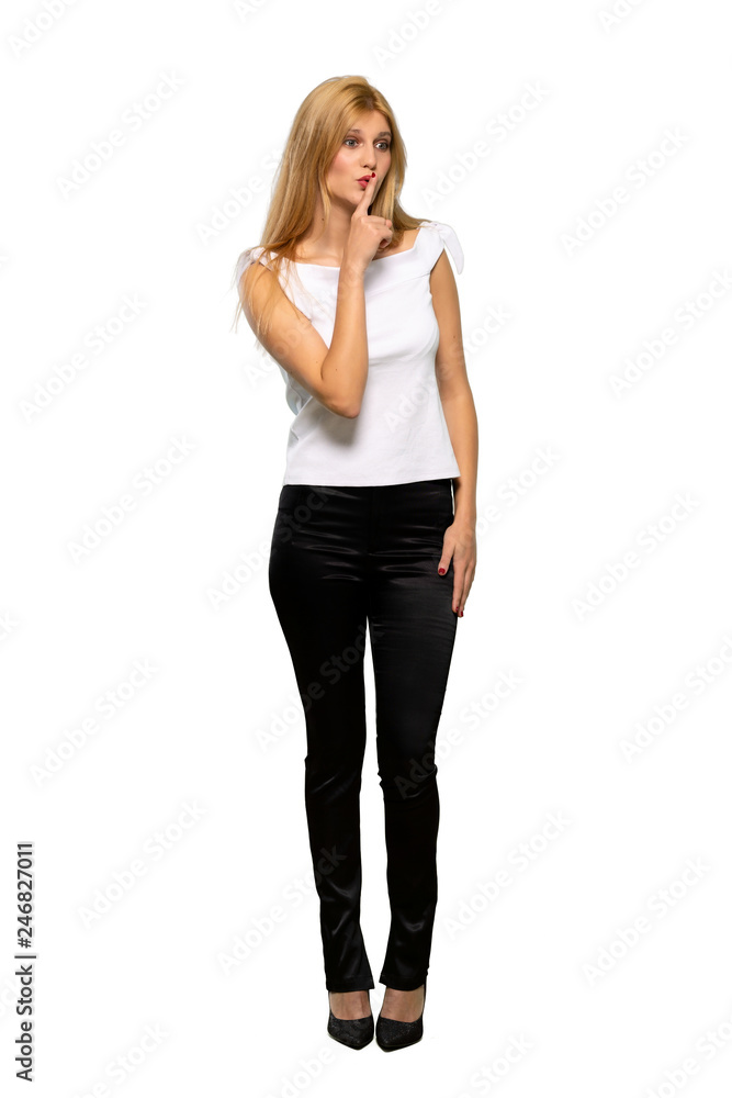 Young blonde woman showing a sign of silence gesture putting finger in mouth over isolated white background Young blonde woman showing a sign of silence gesture putting finger in mouth over isolated white background
