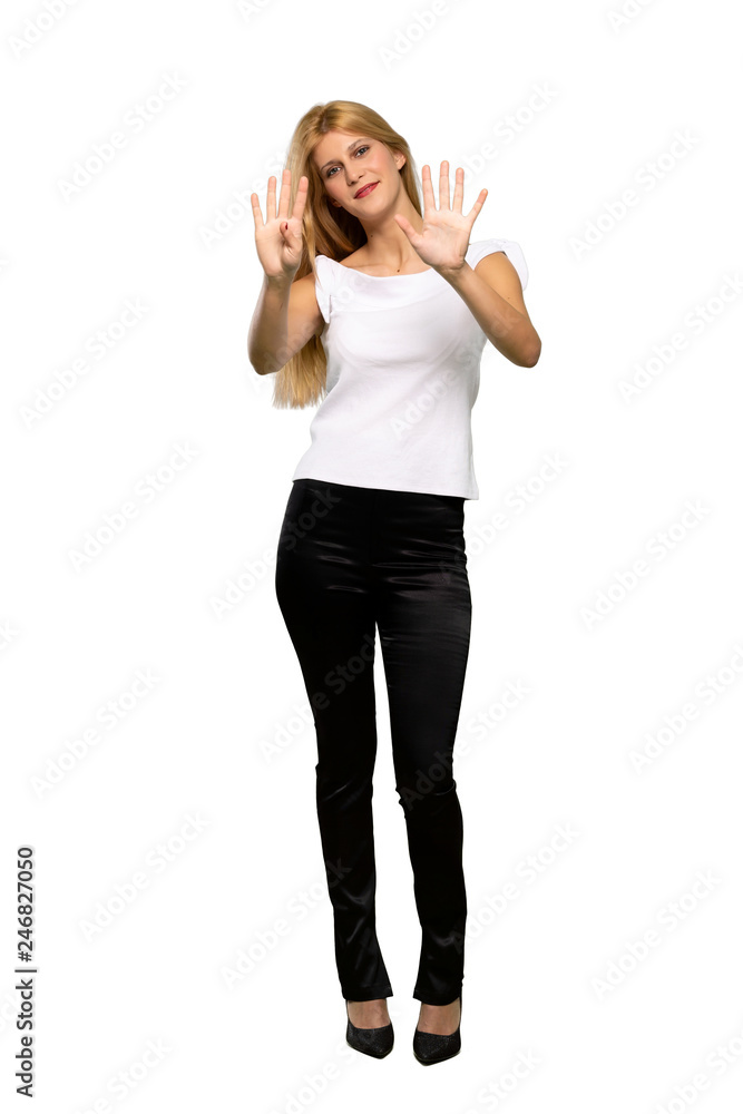 Young blonde woman counting nine with fingers over isolated white background Young blonde woman counting nine with fingers over isolated white background