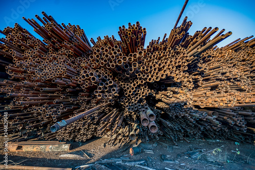 bunch of rust pipes is made one by one photo