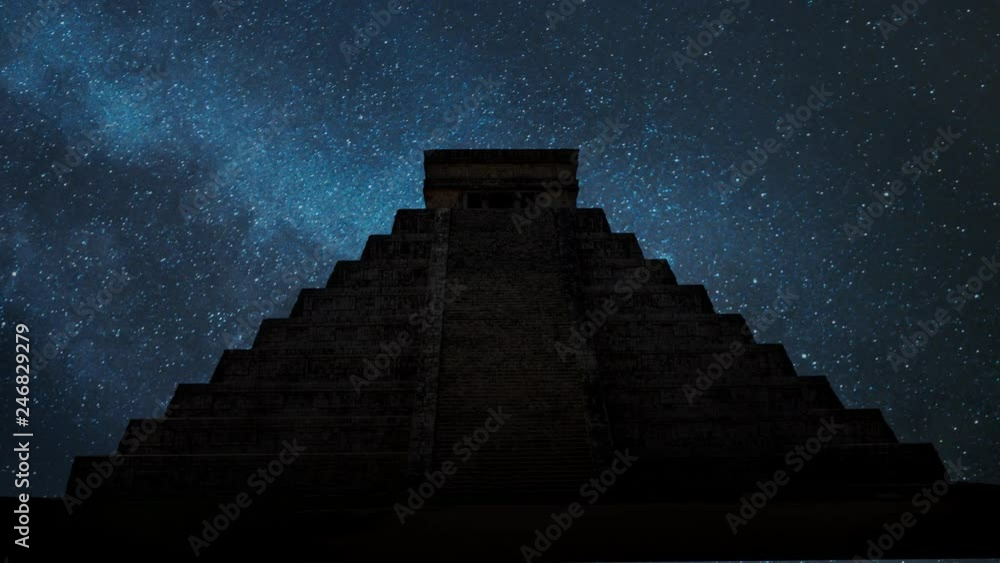 Ancient Mayan pyramid ( Kukulcan Temple ) by Night, Time Lapse with with Stars and Milky Way in Background , UNESCO world heritage site, Chichen Itza, Yucatan, Mexico.