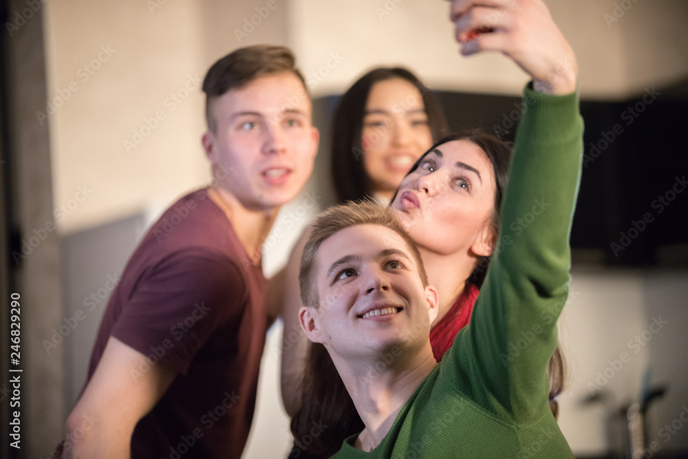Fototapeta premium Young friends taking a selfie and posing