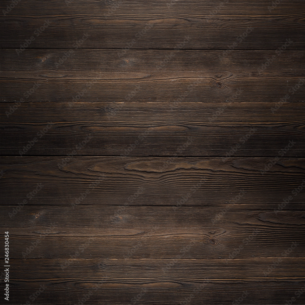 Fototapeta premium The texture of the wooden Board dark brown old house