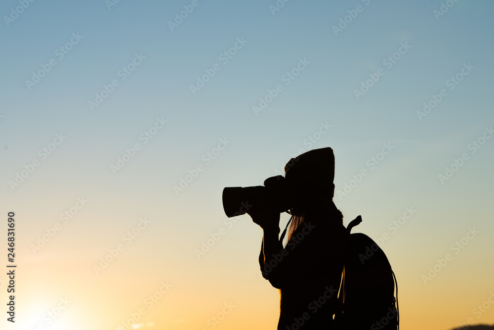 Silhouette of tourist woman standing in the mountain