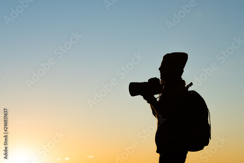 Silhouette of tourist woman standing in the mountain