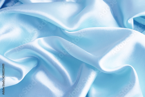 Smooth elegant blue silk or satin texture can use as abstract background.