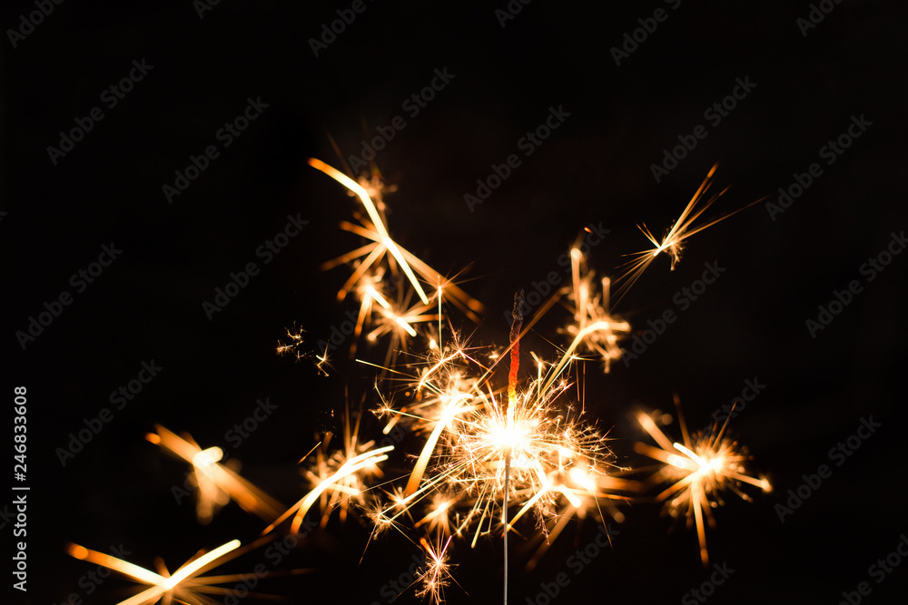 Christmas sparkler on black background