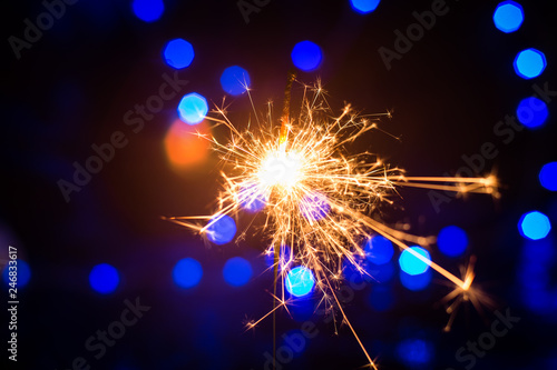 Christmas sparkler with light bokeh background