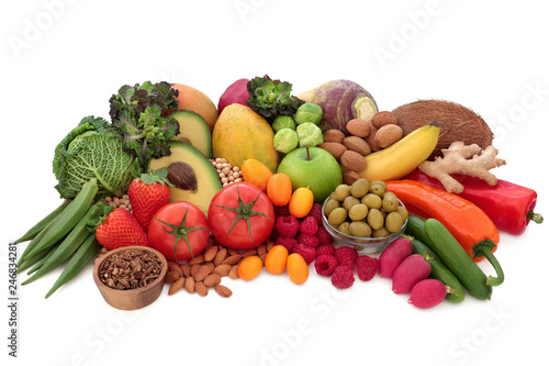 Alkaline super food concept for ph balance including fresh vegetables, fruit, nuts, legumes, herbs, spice, pasta and nuts. High in omega 3, antioxidants, anthocyanins, fibre and vitamins, on white.