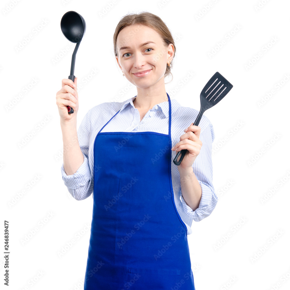 Woman in blue apron with kitchen utensils tools in hand on white background isolation Woman in blue apron with kitchen utensils tools in hand on white background isolation