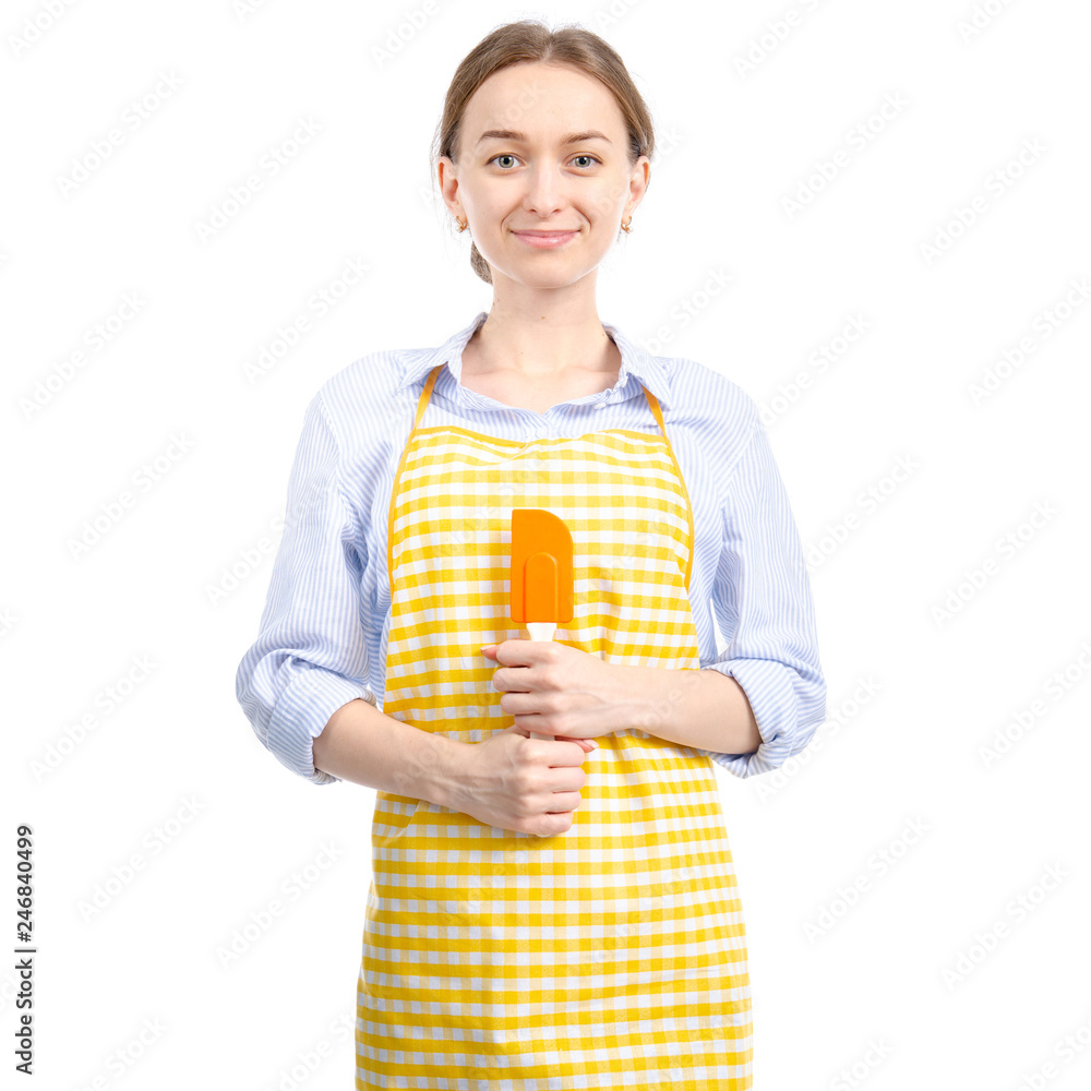 Woman in yellow apron with kitchen spatula in hand on white background isolation