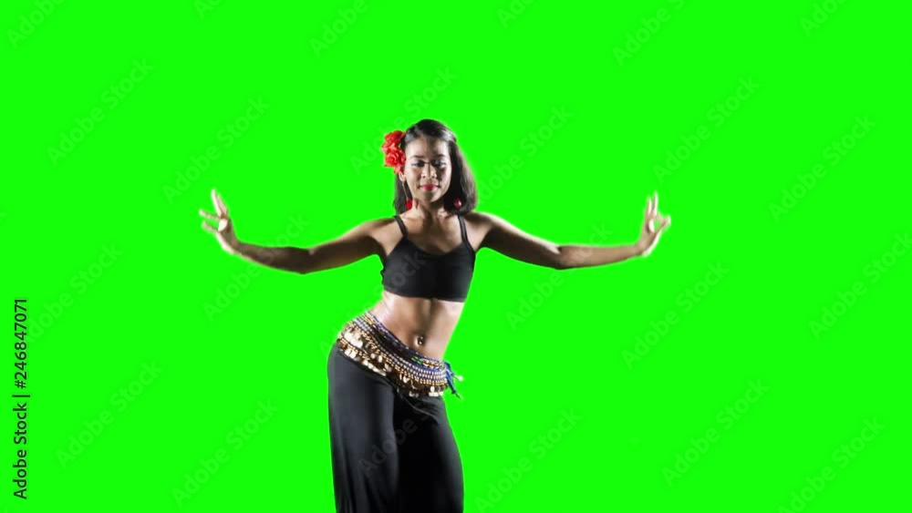Beautiful young woman exercising zumba dance in the studio. Shot in 4k resolution with green screen background Beautiful young woman exercising zumba dance in the studio. Shot in 4k resolution with green screen background