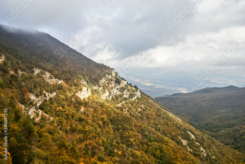 Clouds over the mountains. Autumn. Gloomy sky © Olha Nion