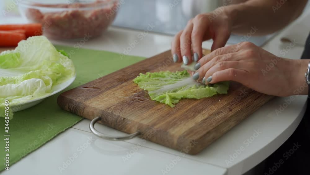 Process of cooking stuffed cabbage rolls with meat and rice.