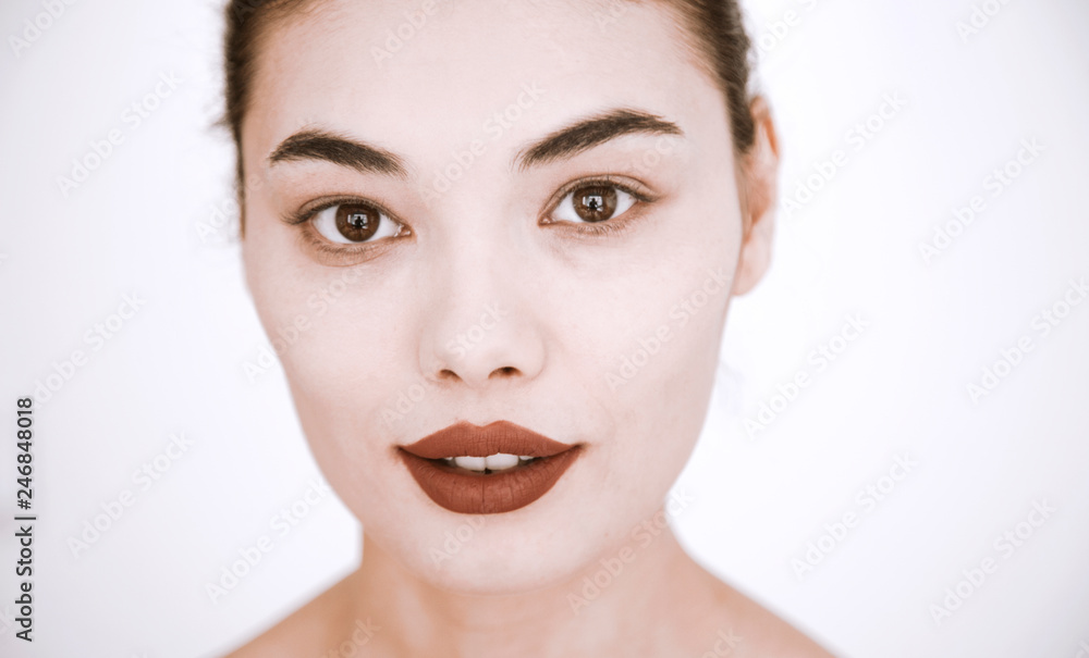 Healthy skin woman beautiful face close up over gray background Healthy skin woman beautiful face close up over gray background