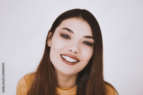 Young woman portrait isolated looking at camera 