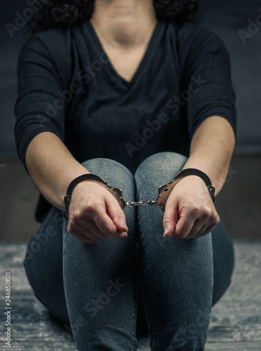 women handcuffed in criminal concept 