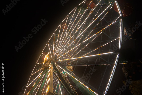 Ferris wheel at the amusement park, night illumination